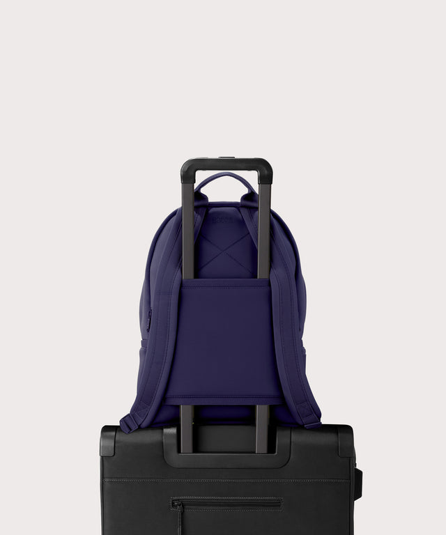 Medium Dakota in a jewel-toned, deep blue with strong purple undertones. displaying luggage sleeve