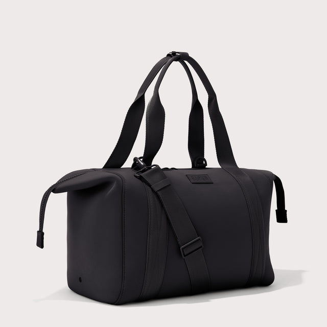 Large Landon Carryall in black with zippers unbuckled