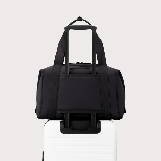 Large Landon Carryall in black displaying luggage sleeve