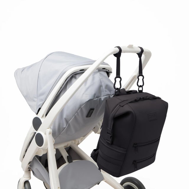 Dagne Dover Large Indi Diaper Backpack in onyx attached to a stroller.