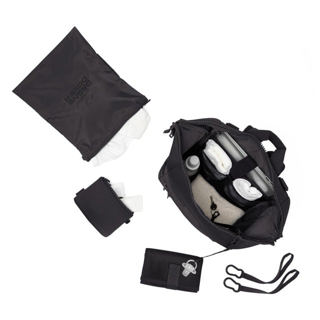 Dagne Dover Large Indi Diaper Backpack in onyx showing it's water resistant bag, interior pockets, and changing mat.