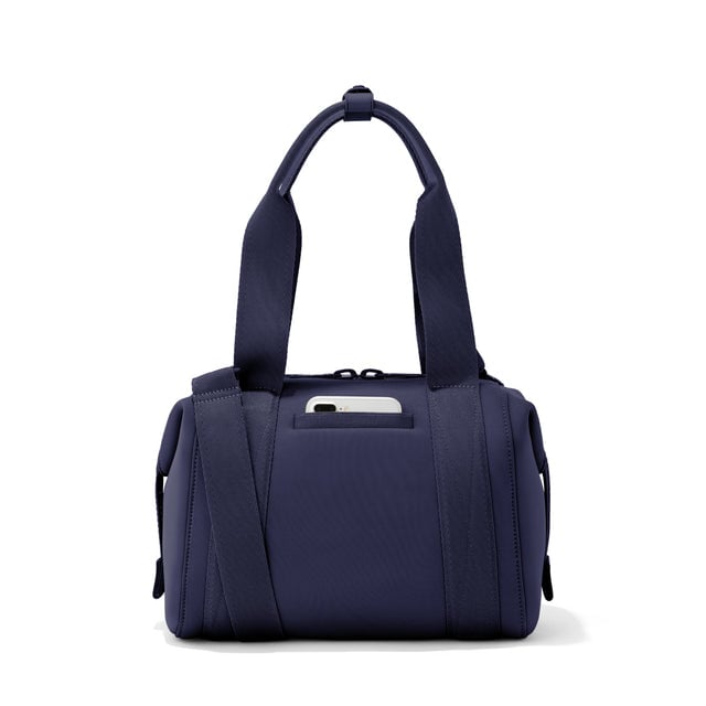 Small Landon Carryall in navy blue, displaying an exterior phone pocket