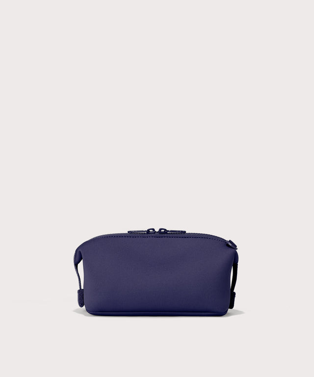 Hunter small toiletry bag in a jewel-toned, deep blue with strong purple undertones. Back view.