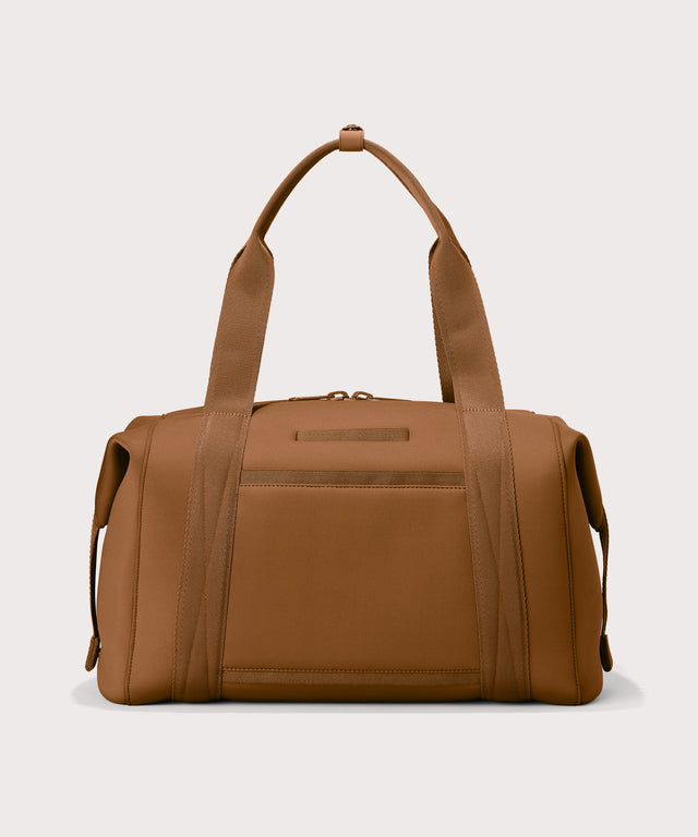 Large Landon Carryall in a a saturated, warm medium-brown with burnt orange undertones, displaying an exterior phone pocket