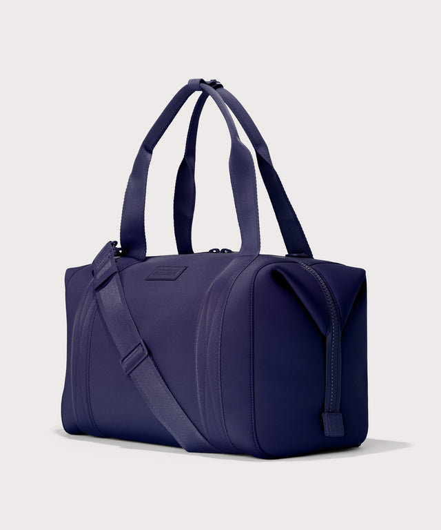 Large Landon Carryall in a jewel-toned, deep blue with strong purple undertones, side angle view