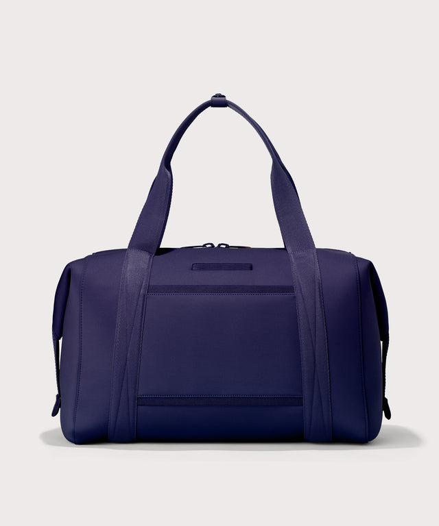 Extra Large Landon Carryall in a jewel-toned, deep blue with strong purple undertones, displaying an exterior phone pocket