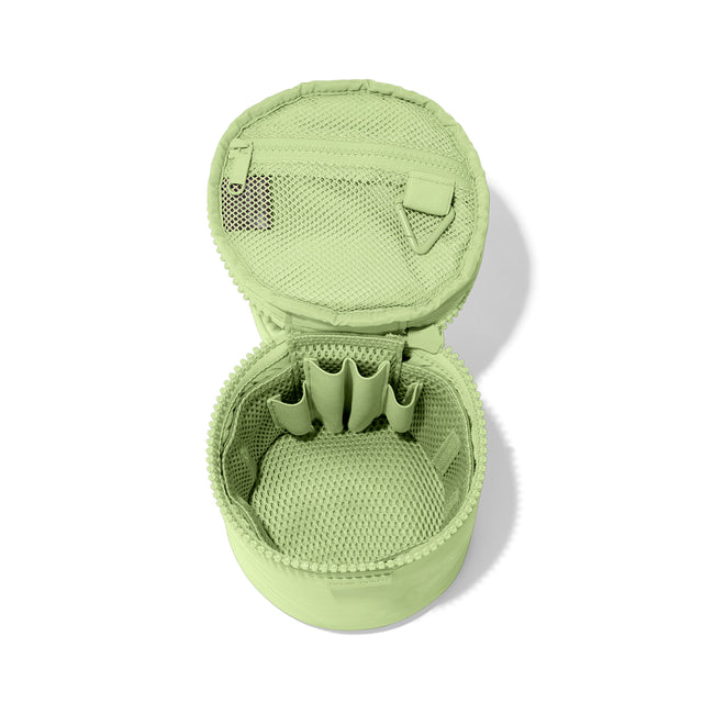 Dagne Dover small Mila Toiletry Pouch in matcha green unzipped with the removable airmesh insert.