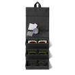 Dagne Dover Remi foldable glasses holder in black hung up and holding glasses. hover