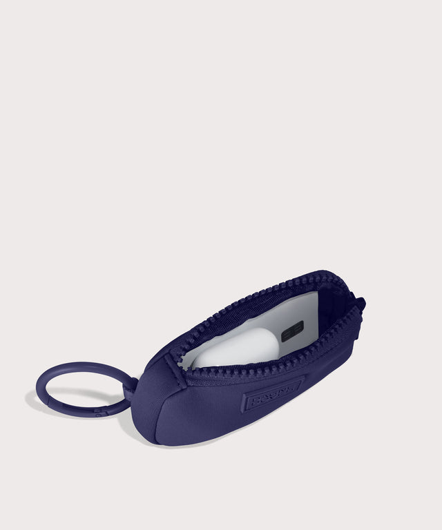 Mara Keychain in a jewel-toned, deep blue with strong purple undertones . unzipped, top down view.
