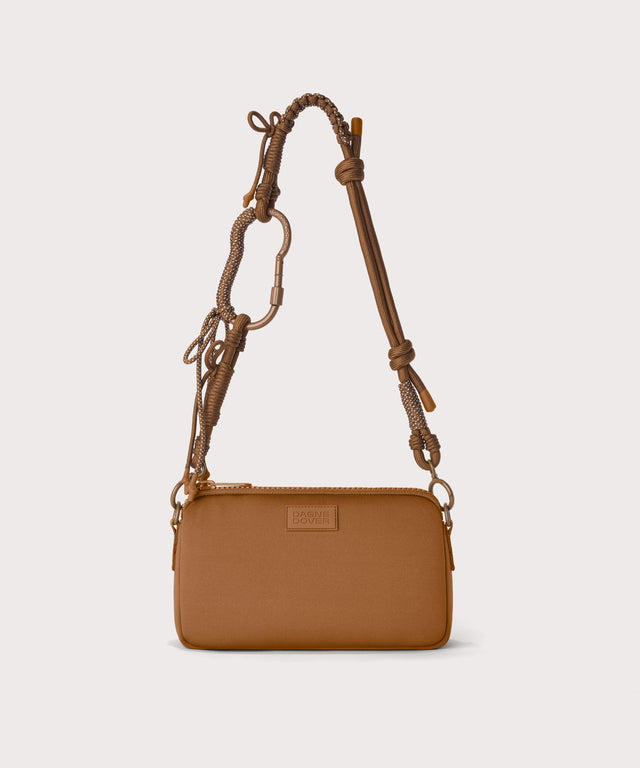 Corded strap on a nora shoulder bag in a saturated, warm medium-brown with burnt orange undertones