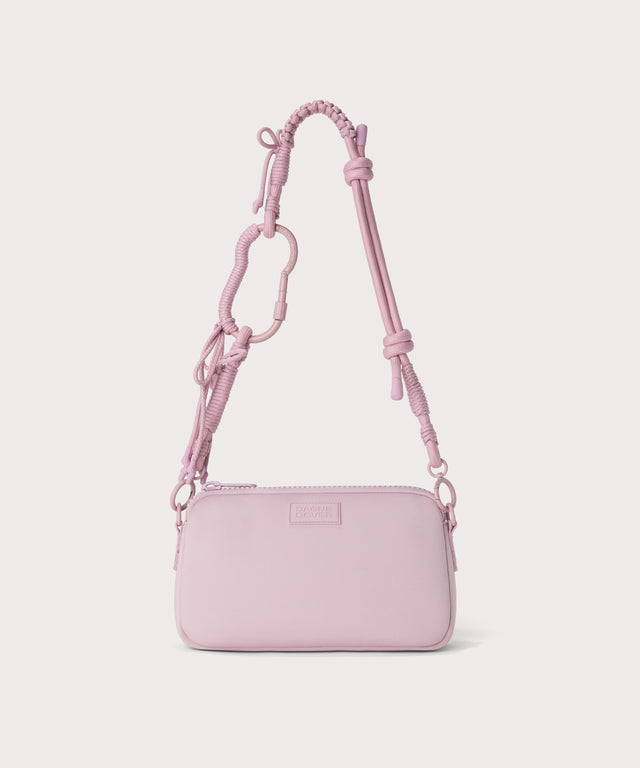 corded strap on a nora shoulder bag in a  cool, powdery pink with soft grey undertones.
