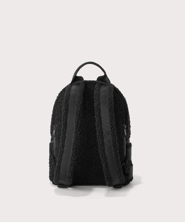 Dakota Small backpack pack in a black  Back view.  In a  Faux Shearling  a soft, wool-like plush made with recycled materials