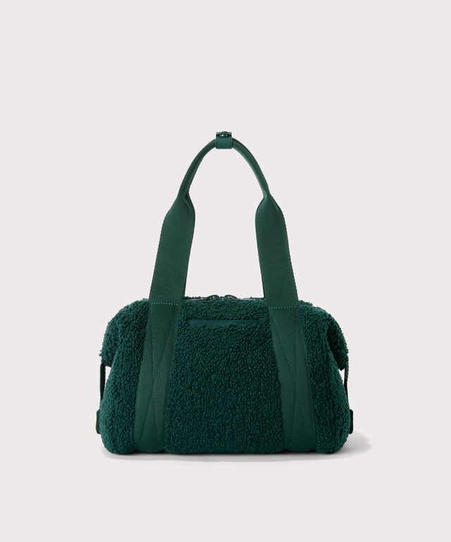 small landon carryall in a saturated, jewel-toned deep green with bold blue undertones.  Back view.  In a  Faux Shearling  a soft, wool-like plush made with recycled materials