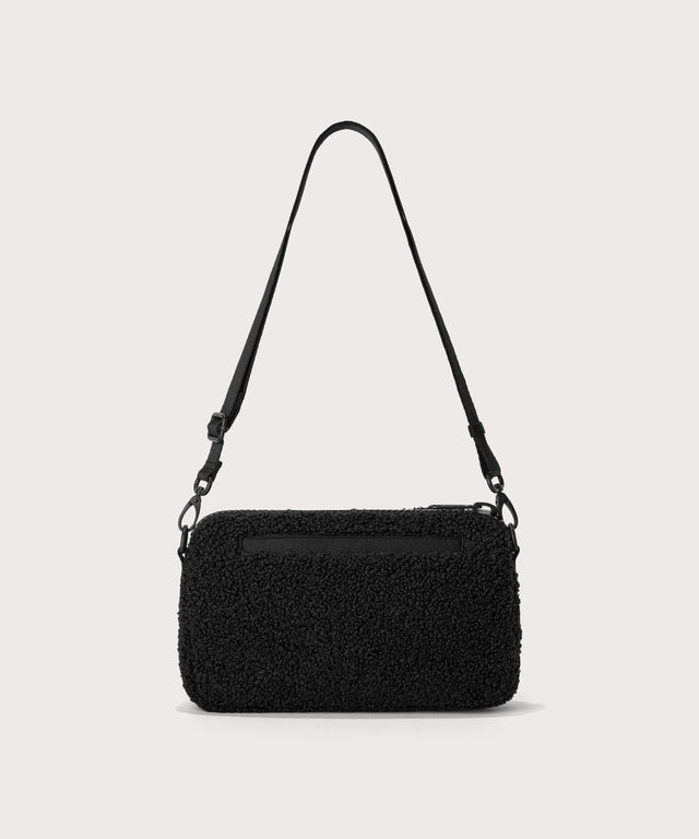 nora shoulder bag in a black.  Back view.  In a  Faux Shearling  a soft, wool-like plush made with recycled materials