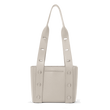 Dagne Dover Tokyo Turnlock Tote in white, revealing the exterior slip pocket.