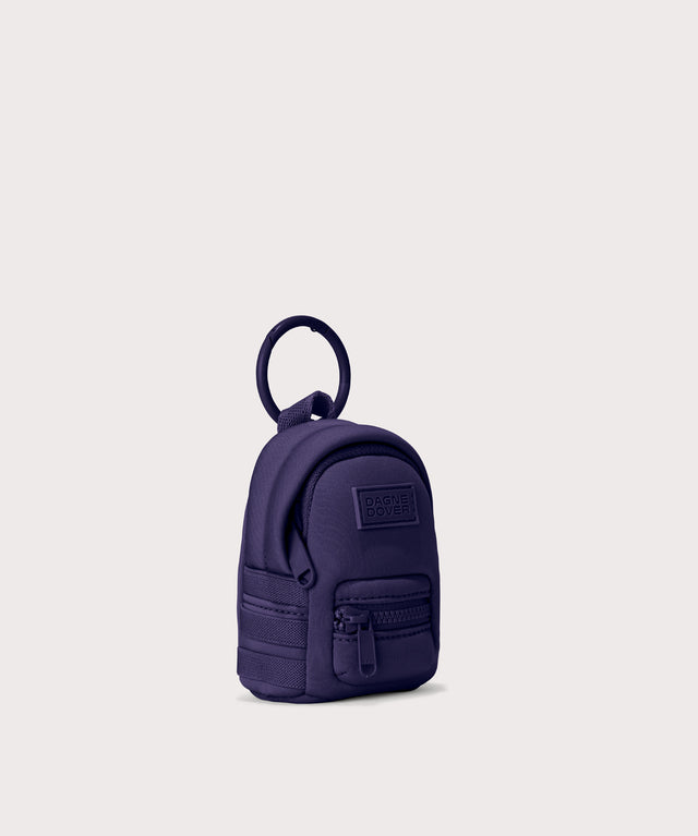 Dakota keychain in a a jewel-toned, deep blue with strong purple undertones. side angle view