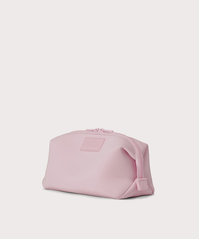 Hunter Large toiletry bag in a cool, powdery pink with soft grey undertones, side angle view