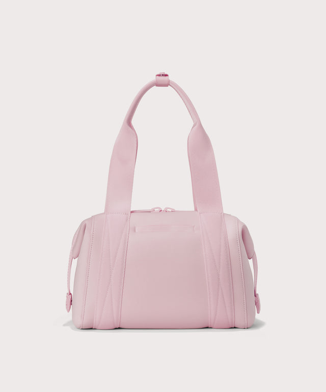 Small Landon Carryall in a cool, powdery pink with soft grey undertones, displaying an exterior phone pocket