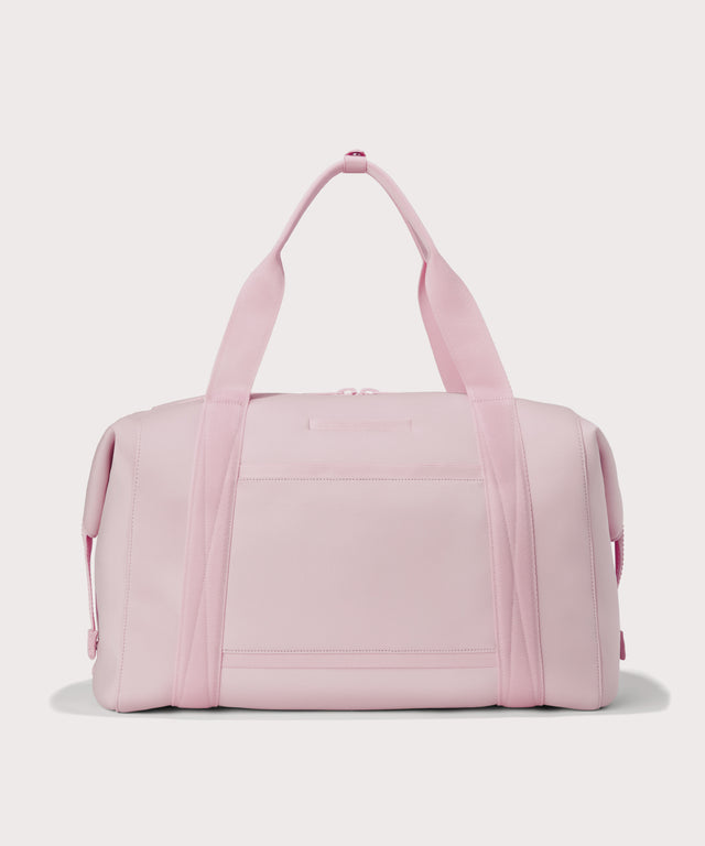 Extra large Landon Carryall in a cool, powdery pink with soft grey undertones, displaying an exterior phone pocket