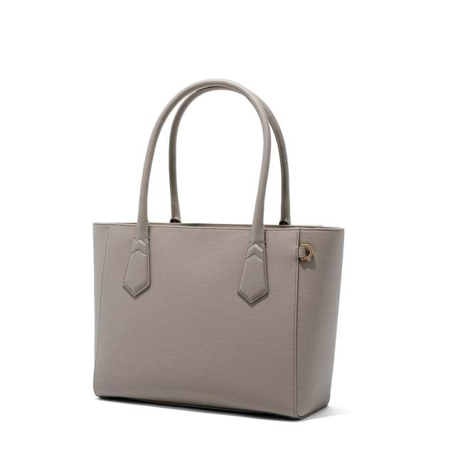Dagne Dover Classic Signature Leather Tote in beige seen from an angle.