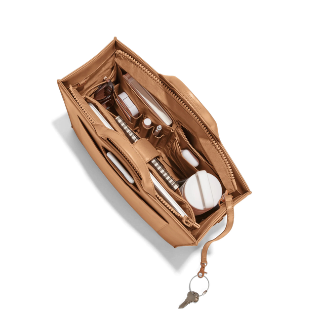 hover - Dagne Dover medium vegan Daily Tote in brown from above, revealing the interior zipper, interior slip pockets, and padded laptop sleeve.