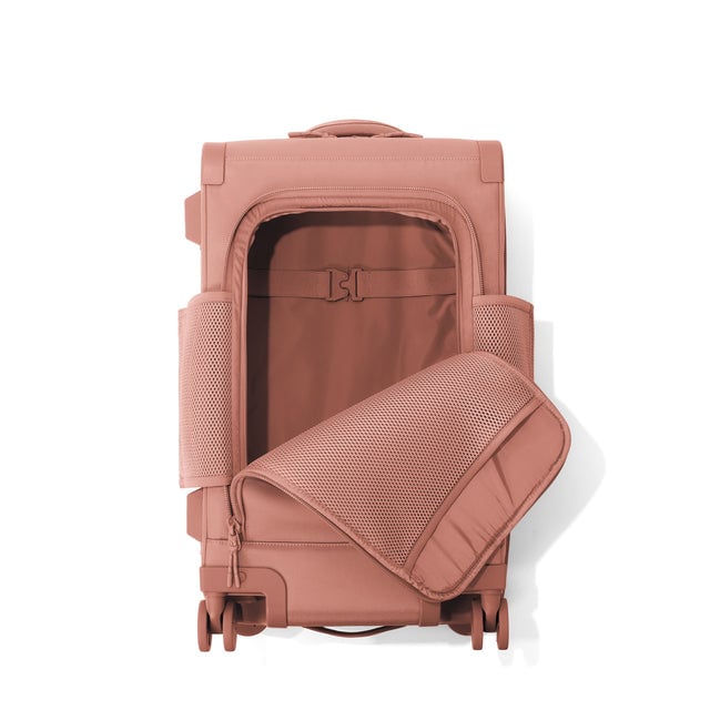 Top down of Seattle carry-on rolling luggage 23.5” in warm dust with front flap opened. 