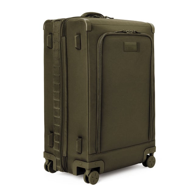 3/4 front view of Sydney checked rolling luggage 28.5” in dark moss showing side luggage feet