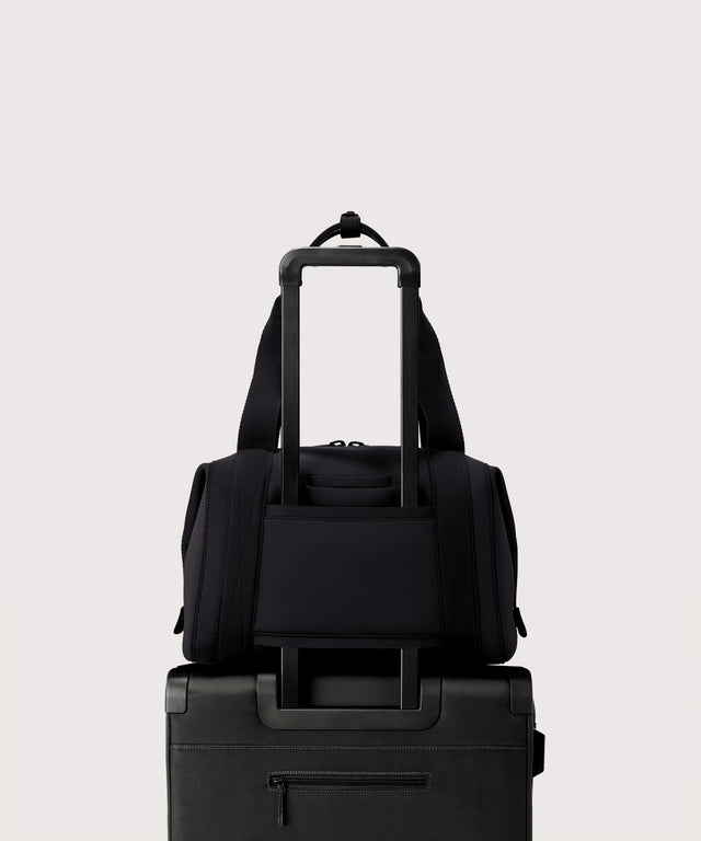 Large Landon Carryall in black displaying luggage sleeve