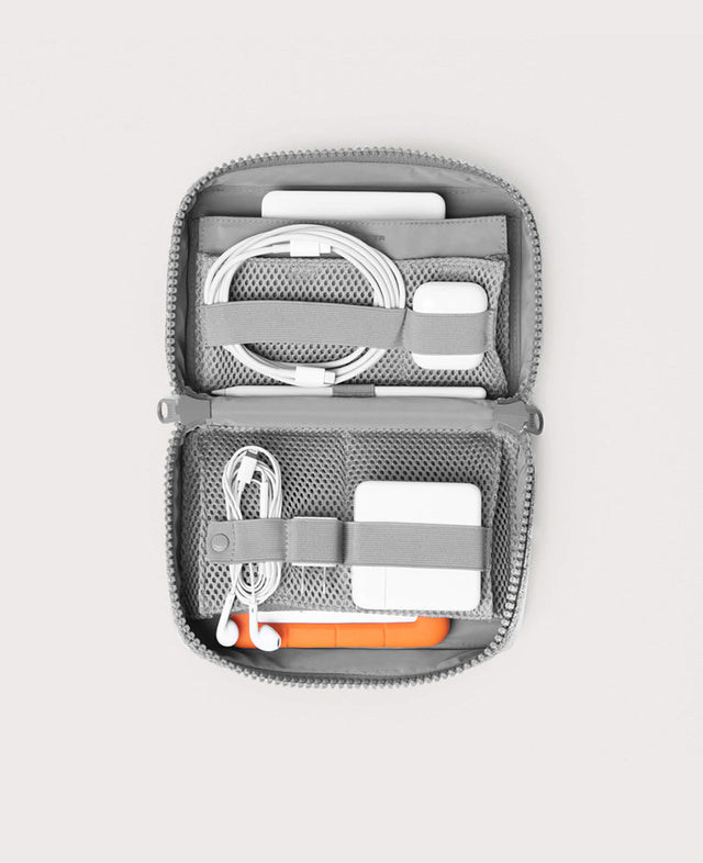 hover - Dagne Dover large Arlo Tech Organizer in grey unzipped, revealing the interior elastic loops and airmesh pockets.