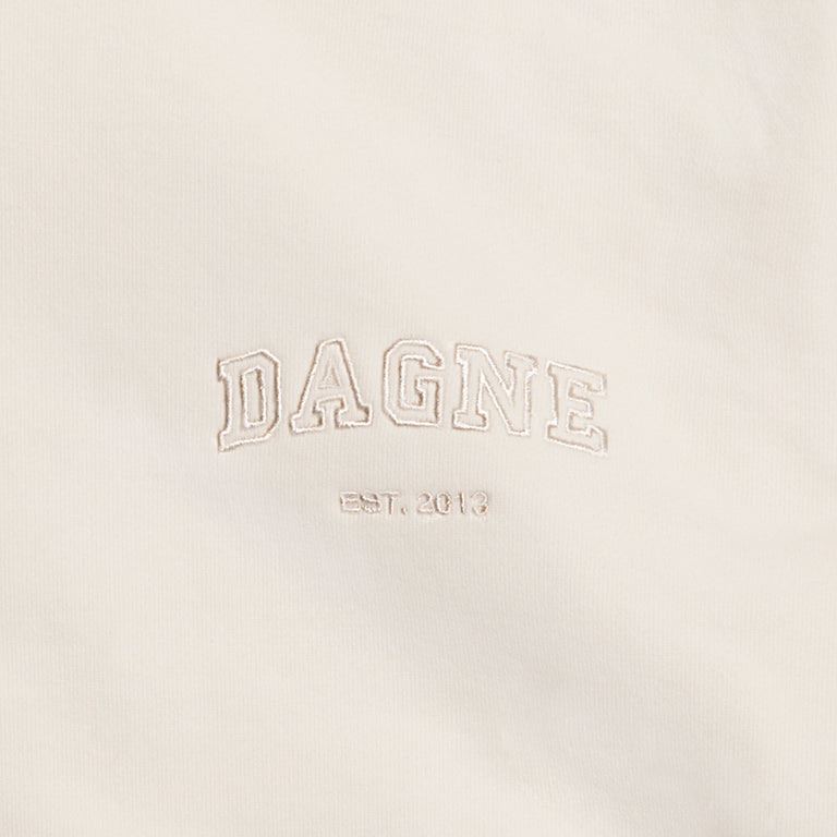 Dagne Dover Hooded Sweatshirt logo closeup in moonbeam.