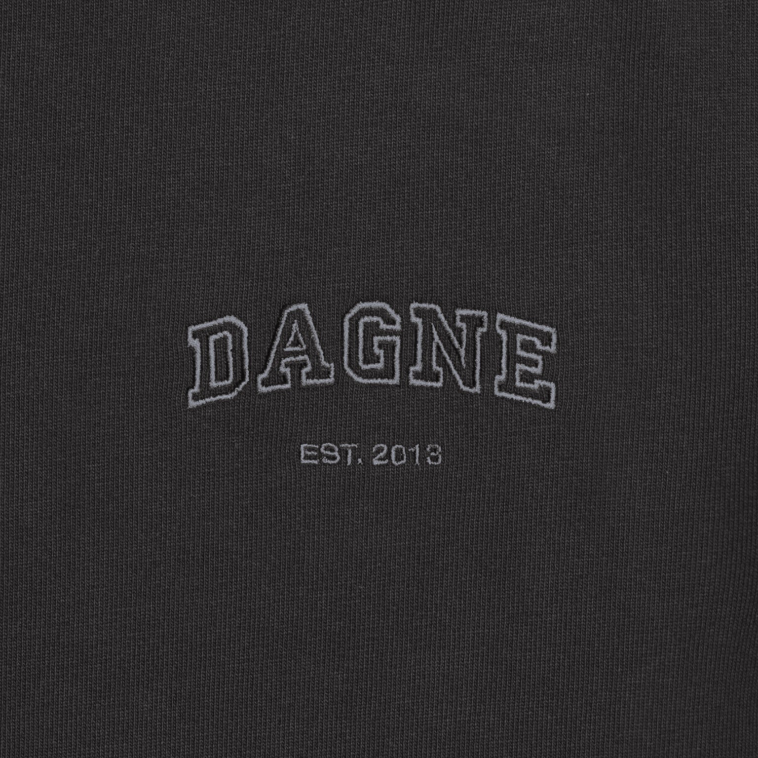 Dagne Dover T-Shirt logo closeup in onyx.