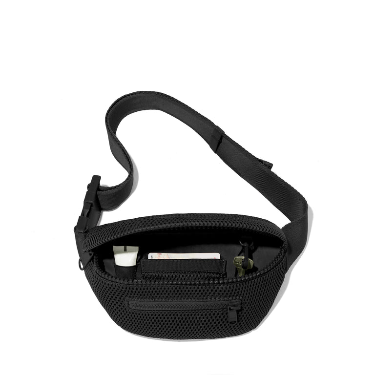 Dagne Dover Ace Fanny Pack in air mesh black  unzipped, exposing the interior pockets