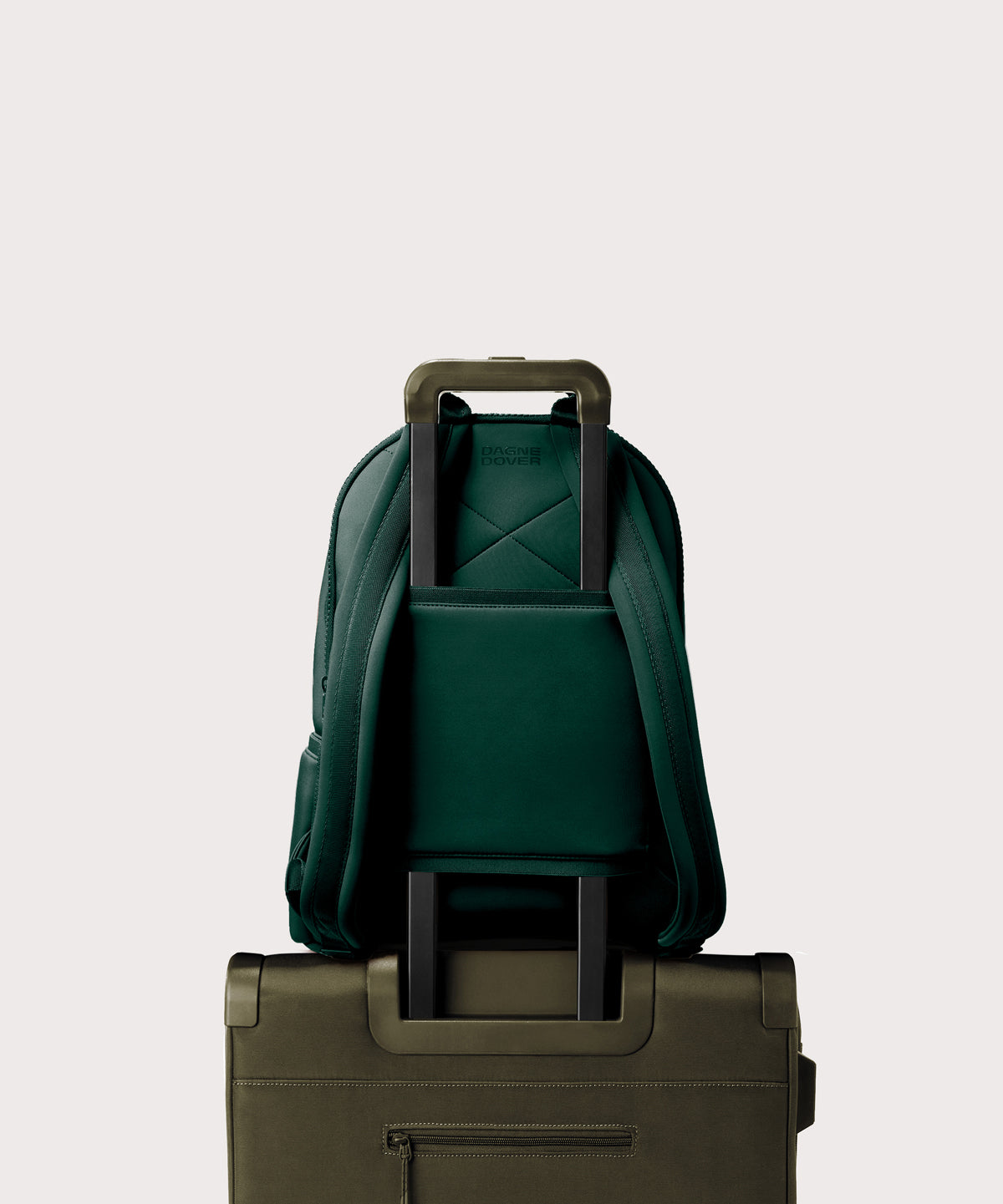 Large Dakota in a saturated, jewel-toned deep green with bold blue undertones. displaying luggage sleeve
