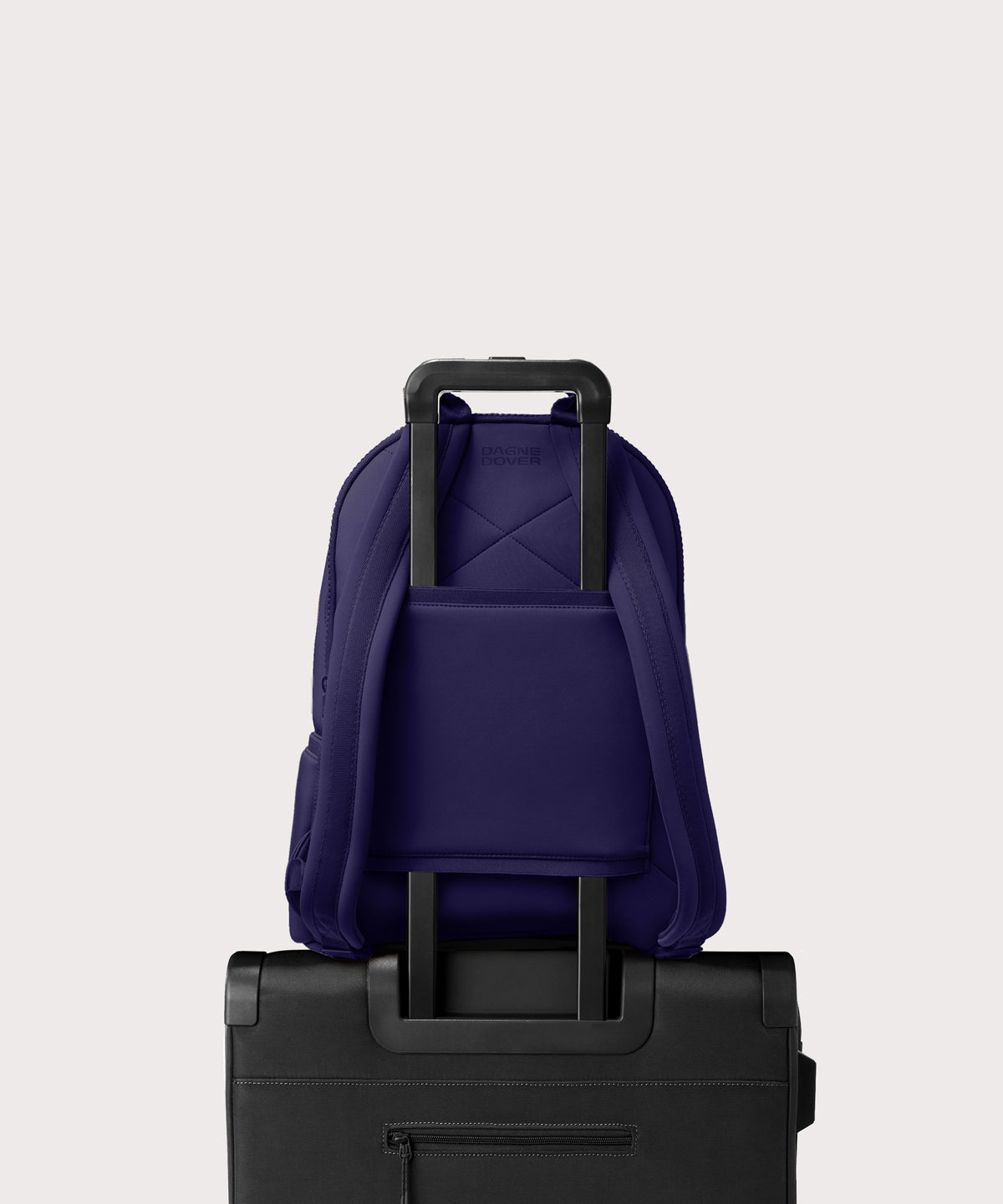 Large Dakota in a jewel-toned, deep blue with strong purple undertones. displaying luggage sleeve
