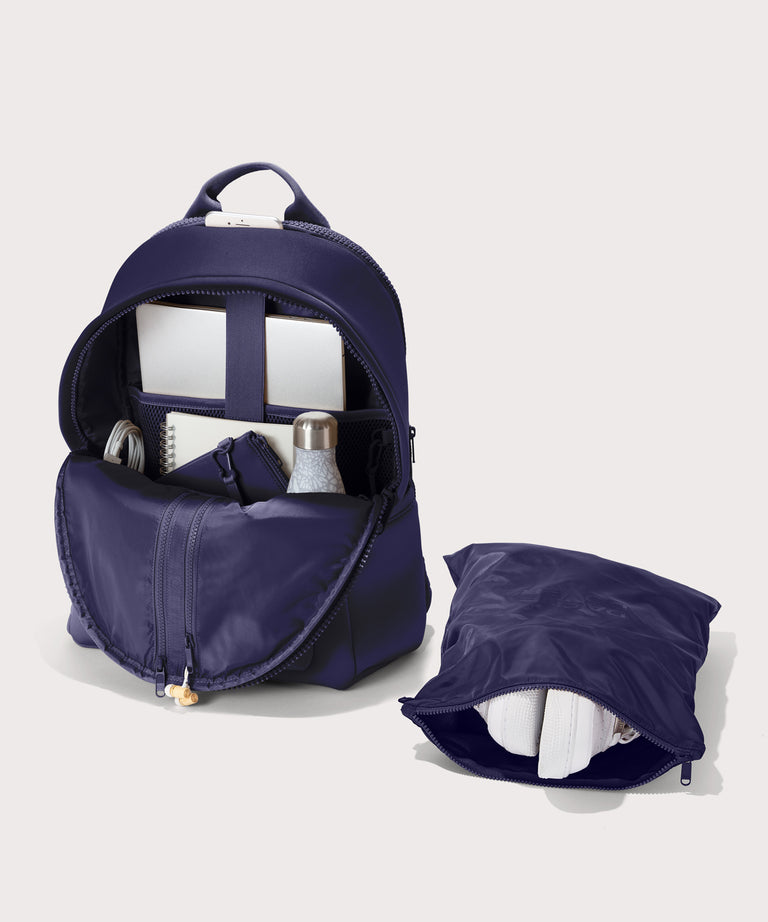 Large Dakota in a jewel-toned, deep blue with strong purple undertones. unzipped, top down view. 
