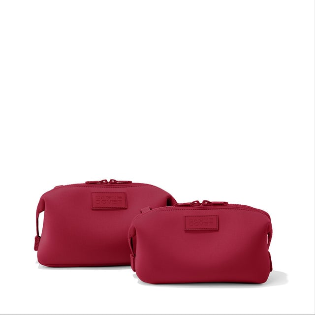 Dagne Dover Small and Large Hunter Toiletry Bags in spice red.