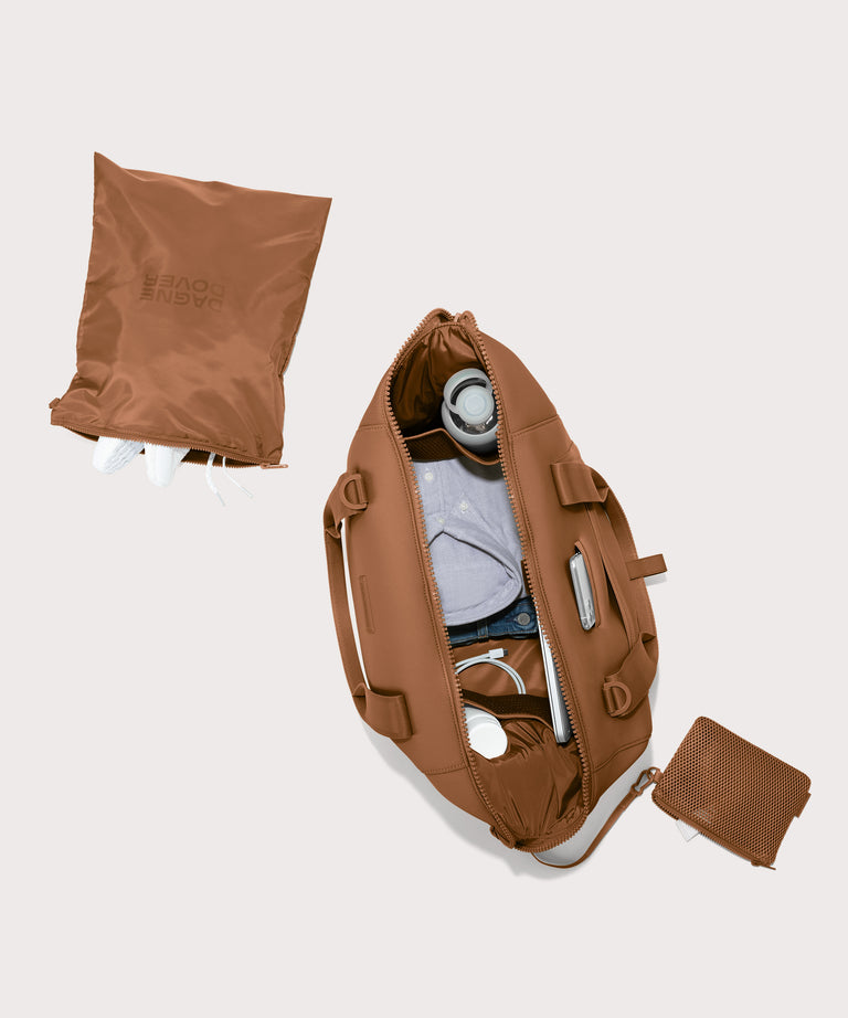 Large Landon Carryall in a a saturated, warm medium-brown with burnt orange undertones unzipped, top down view. 