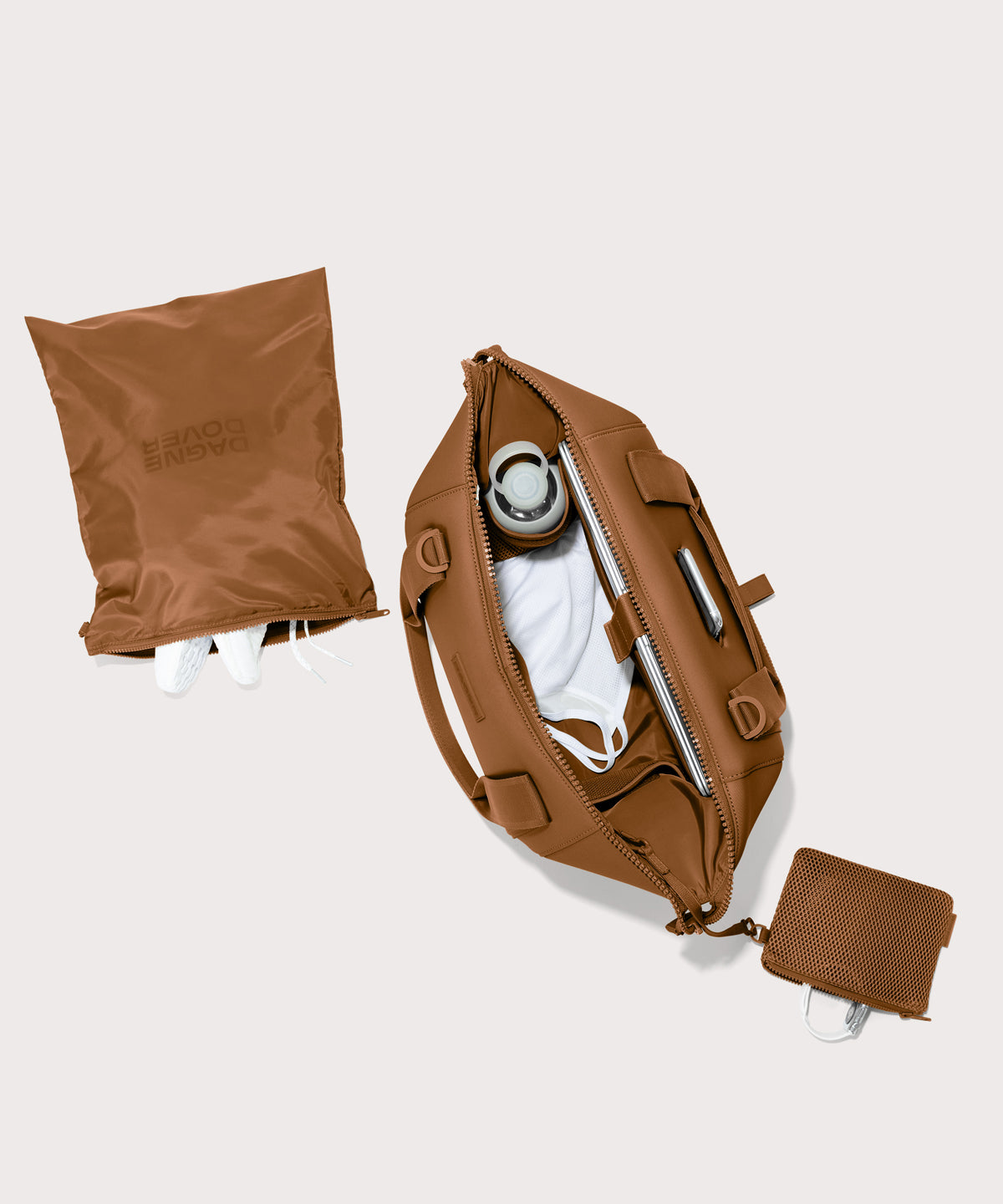 Medium Landon Carryall in a a saturated, warm medium-brown with burnt orange undertones unzipped, top down view. 
