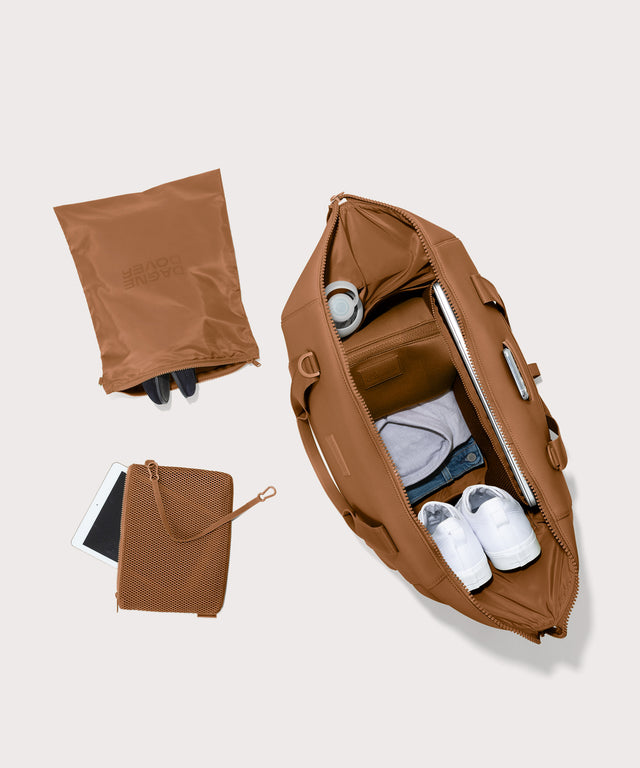 Extra Large Landon Carryall in a a saturated, warm medium-brown with burnt orange undertones unzipped, top down view. 
