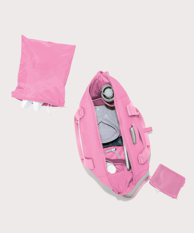 Dagne Dover Large Landon Carryall in a true bubble gum pink, unzipped top down view.