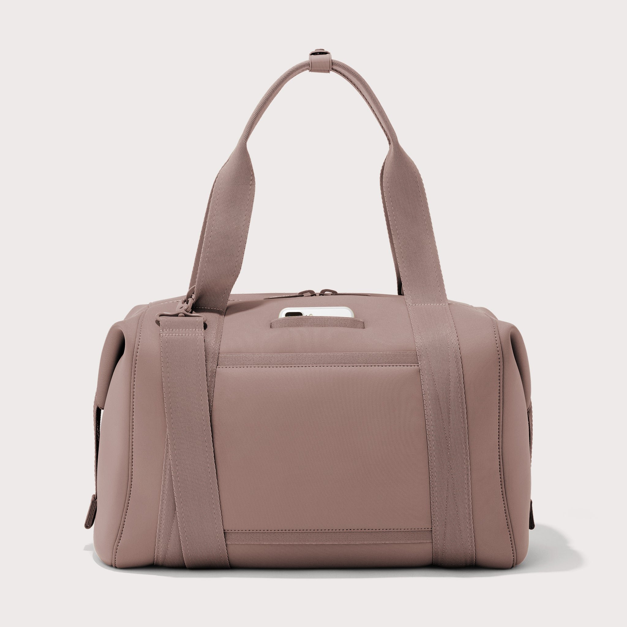Large Landon Carryall in pink, displaying an exterior phone pocket
