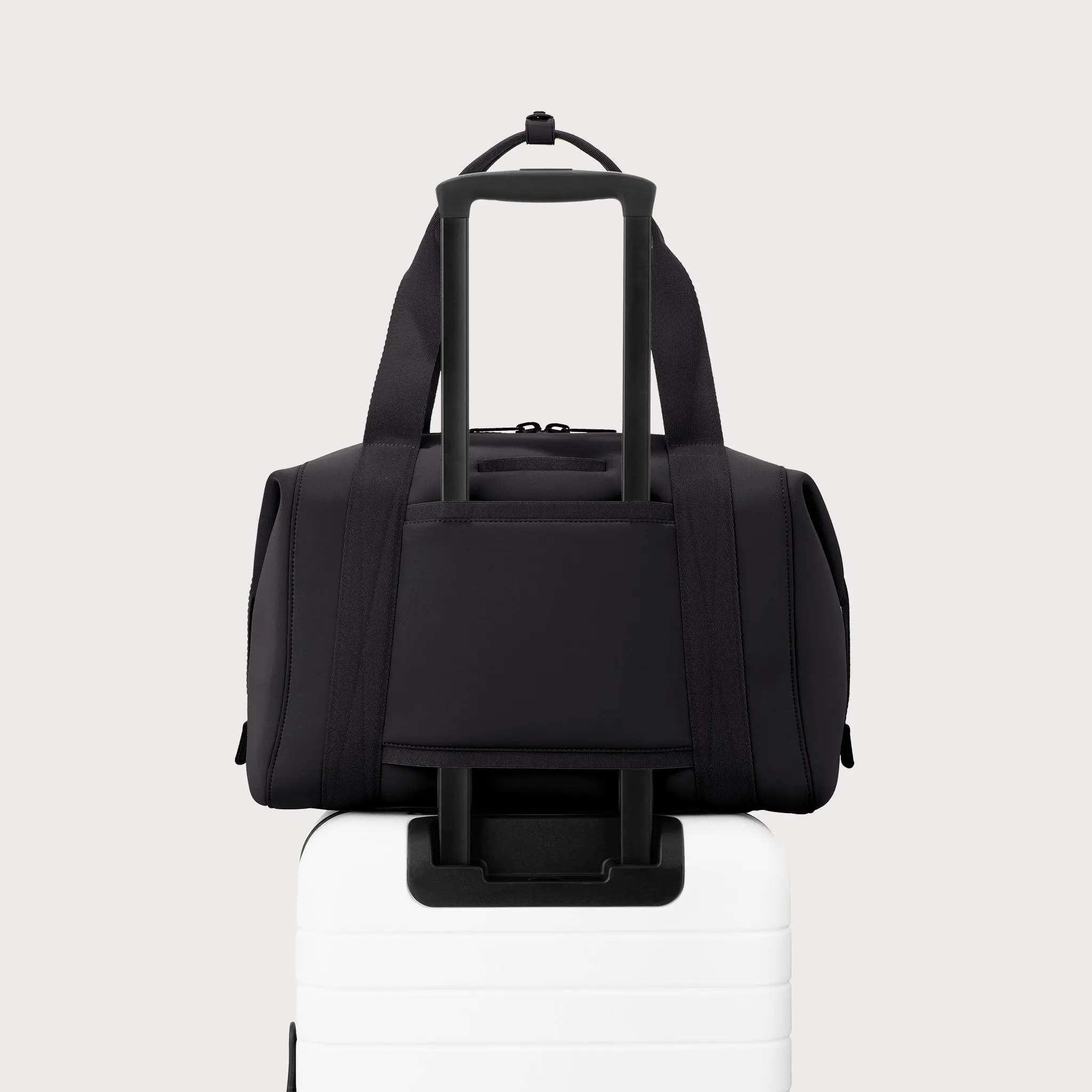 Large Landon Carryall in black displaying luggage sleeve