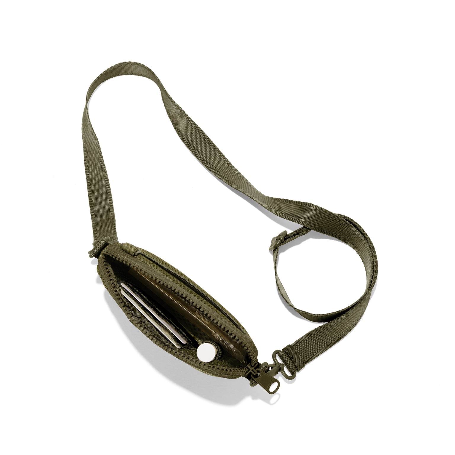 Dagne Dover Mara Phone Sling unzipped in dark green air mesh seen from above, exposing the interior card slots.