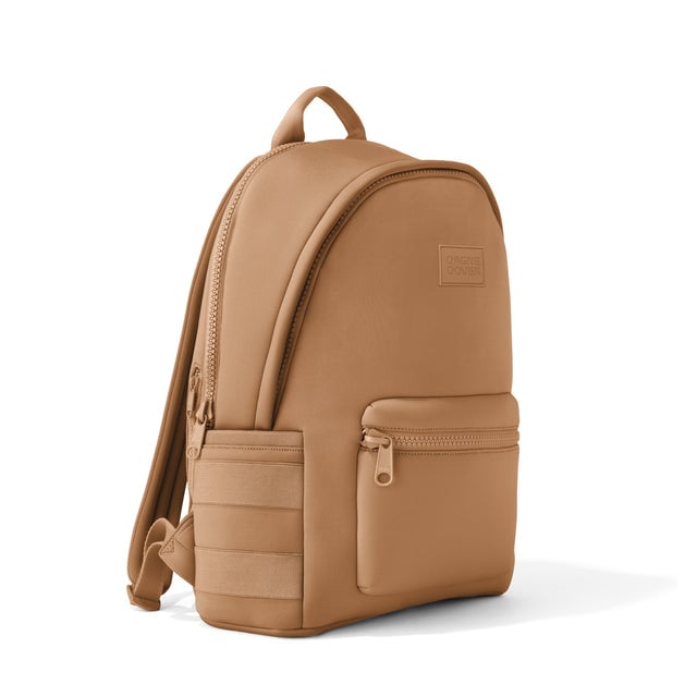 Dagne Dover large Dakota Neoprene Backpack in camel brown seen from an angle.