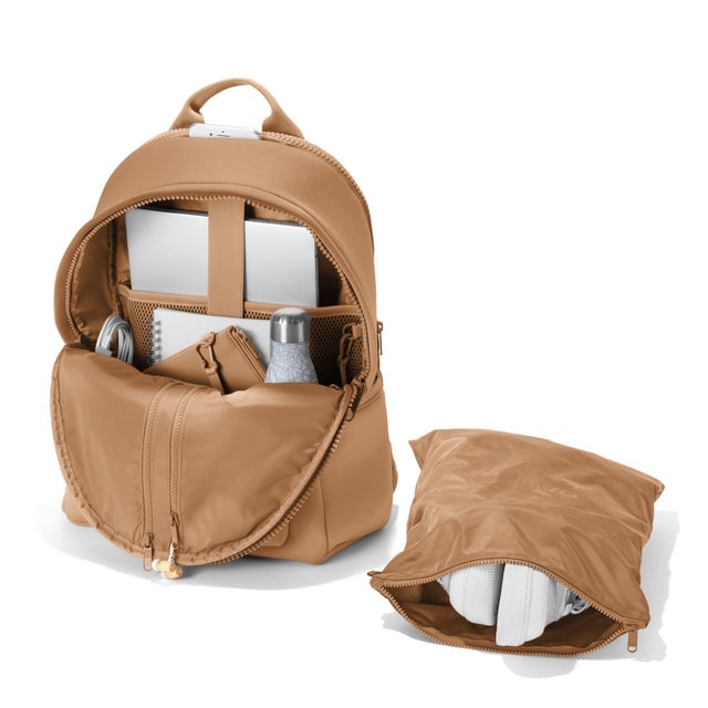 Dagne Dover large Dakota Neoprene Backpack in camel brown unzipped, showing the interior pockets and shoe bag.