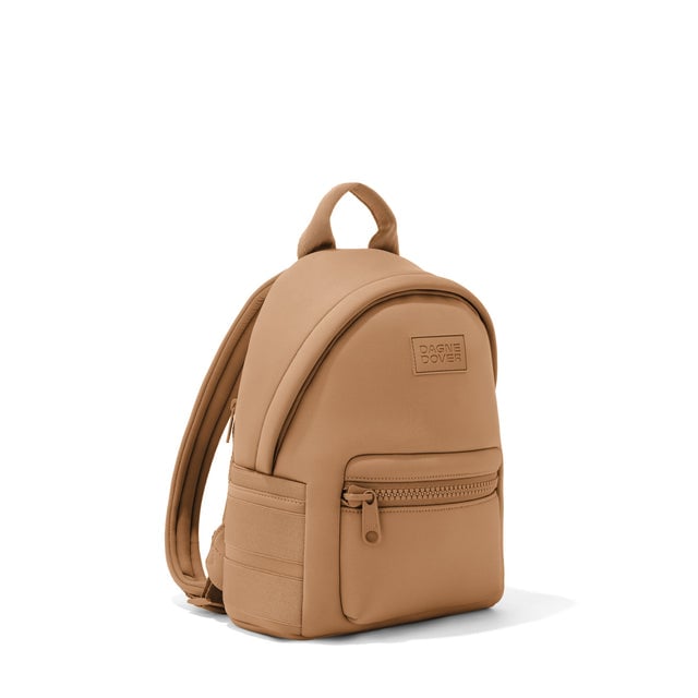 Dagne Dover small Dakota Neoprene Backpack in camel brown seen from an angle.