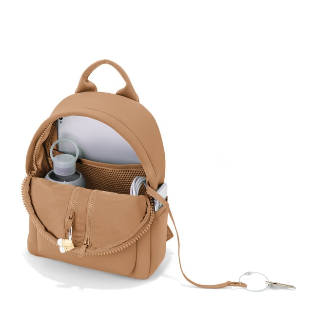Dagne Dover small Dakota Neoprene Backpack in camel brown unzipped, showing the interior pockets and key leash.