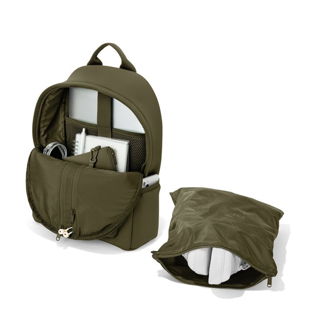 Dagne Dover medium Dakota Neoprene Backpack in dark moss unzipped, showing the interior pockets and shoe bag.