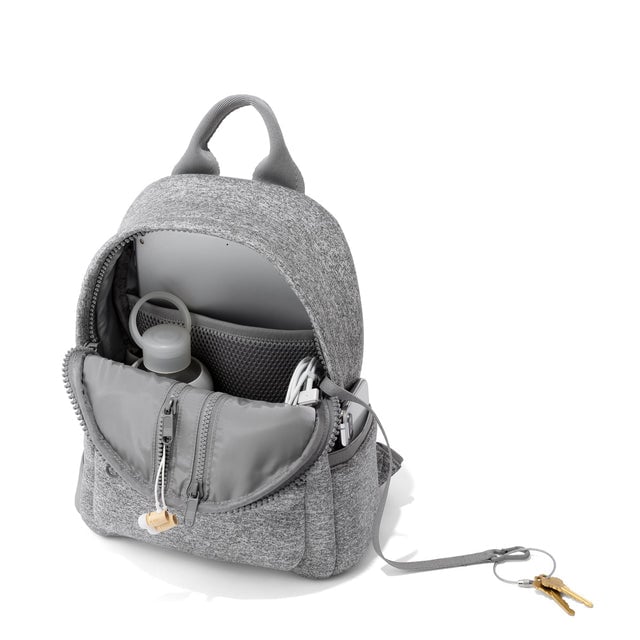 Dagne Dover small Dakota Neoprene Backpack in grey unzipped, showing the interior pockets and key leash.