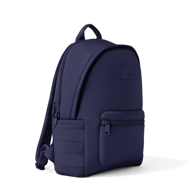 Dagne Dover large Dakota Neoprene Backpack in dark blue seen from an angle.